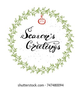 Vector Christmas Greeting Card design with lettering "Season's Greetings".