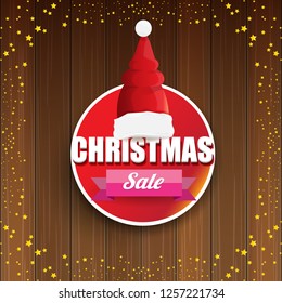 vector Christmas sales banner or tag label with red santa hat on wooden background with stars. Red winter Christmas sale poster design template or background - Vector