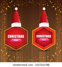 vector Christmas sales banner or tag label with red santa hat on wooden background with stars. Red winter Christmas sale poster design template or background - Vector