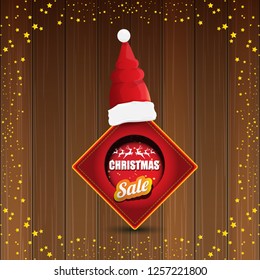 vector Christmas sales banner or tag label with red santa hat on wooden background with stars. Red winter Christmas sale poster design template or background - Vector