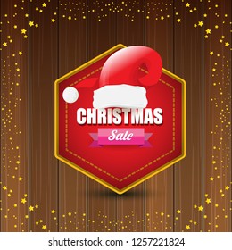 vector Christmas sales banner or tag label with red santa hat on wooden background with stars. Red winter Christmas sale poster design template or background - Vector