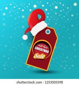 vector Christmas sales paper banner or tag label with red santa hat on snowy azure background with falling snowflakes. Red winter Christmas sale poster design template or background