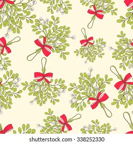 Vector Christmas seamless pattern with branches of mistletoe. For fabric, wrapping paper, print and web projects. Greeting card design. Vector mistletoe. Winter template.