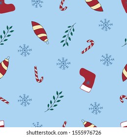 Vector christmas seamless pattern with candy canes, winter plants, snowflakes and christmas decorations