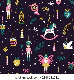 Vector Christmas seamless pattern with hanging Christmas ornaments, nutcracker, doll, rocking horse, candles and snowflakes. Holiday repeated texture with kids toys. Magical print. Nutcracker ballet.