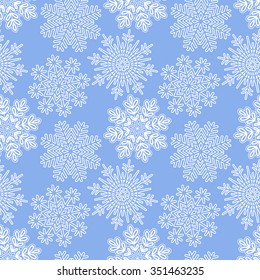 Vector Christmas seamless pattern with openwork white snowflakes on a blue background. Eps 10.