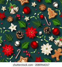 Vector Christmas seamless pattern with red and white poinsettia flowers, balls, bells, holly, mistletoe, gingerbread cookies, candy canes, fir branches, and pine cones on a dark green background.