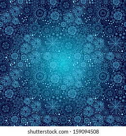 Vector Christmas seamless pattern with snowflakes on a blue background.