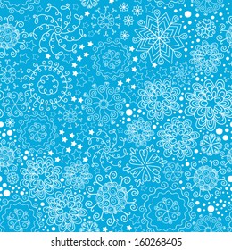Vector Christmas seamless pattern with snowflakes on a blue background.