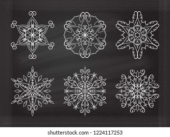 Vector Christmas snowflakes set on a chalkboard background
