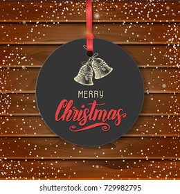Vector Christmas vintage label with hand drawn bells and greeting hand made quote "Merry Christmas" on wooden background. Happy New Year. Lettering, sketch. Banner, poster, flyer, brochure.