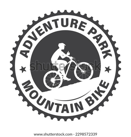 Vector circular logo of a cyclist riding a bike with an inscription: adventure park mountain bike. Isolated on white background.
