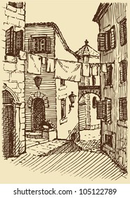Vector cityscape. laundry drying between the houses on the narrow medieval street