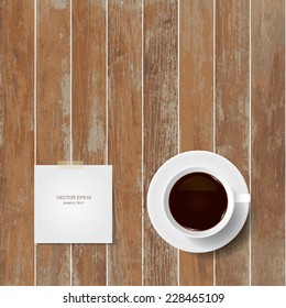 Vector coffee cup and paper stick on wooden texture background.