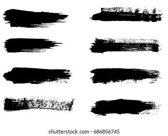 Vector collection of artistic grungy black paint hand made creative brush stroke set isolated on white background. A group of abstract grunge sketches for design education or graphic art decoration