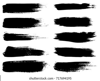 Vector collection of artistic grungy black paint hand made creative brush stroke set isolated on white background. A group of abstract grunge sketches for design education or graphic art decoration