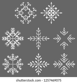 Colección vectorial de copos artísticos de nieve abstracta de cristal aislados en el fondo como grupo de decoración o colección de diciembre de invierno. Hielo o escarcha hermosa silueta de ornamento estrella o arte de temporada