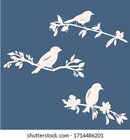 Vector collection of bird silhouettes sitting in tree branches