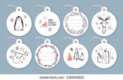 Vector collection of christmas cards, gift tags and badges isolated on light background. Emblems for xmas holiday presents packaging in hand drawn sketch style. Penguin, skates, deer, bear, fir tree.