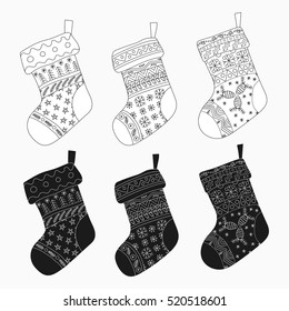 Vector collection of Christmas stockings. Stylized winter black and white socks. Set of decorative Christmas stockings with ornaments. Merry Christmas.
