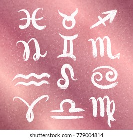 Vector collection of grunge white zodiac signs on rose gold colored glitter background.