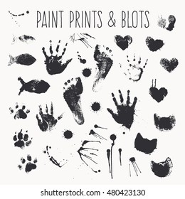 Vector collection of paint prints - footsteps, pawprints, palms, shapes of hearts, cat muzzles, fish, inkblots, stains, smears. Monochrome design elements