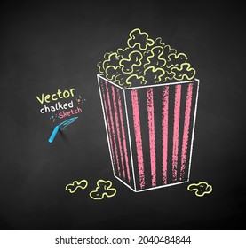 Vector color chalk drawn illustration of pop corn bucket on black chalkboard background.