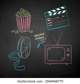 Vector color chalk drawn illustration set of movie symbols on black chalkboard background.