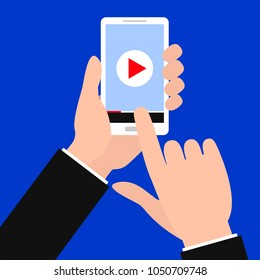 Vector color illustration of a hand holding phone. There is "video-on" on smartphone screen