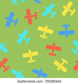 Vector Colored Airplane Silhouette Seamless Pattern on Green Background