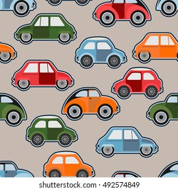 Vector colored cars. Seamless background. Wallpaper in the nursery. On a light background.
