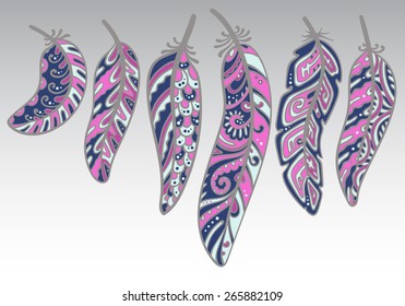 Vector colored feathers set. Bird feathers painted in ornamental patterns  