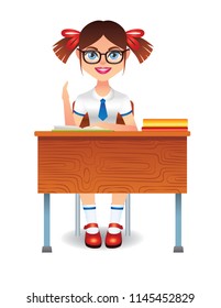 Vector colorful illustration of cute intelligent girl sitting in class at table. A happy student learns from books. A student in uniform pulls her hand upwards