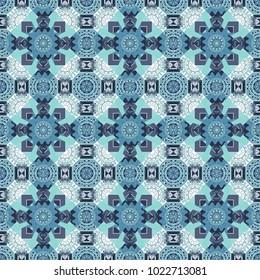 Vector colorful kaleidoscopic seamless pattern for textile, ceramic tiles, wallpapers and fabric. Traditional ethnic background in blue, gray and neutral colors.