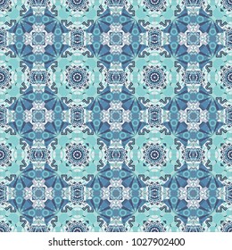 Vector colorful kaleidoscopic seamless pattern for textile, ceramic tiles, wallpapers and fabric. Traditional ethnic background in gray, white and blue colors.