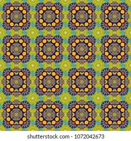Vector colorful kaleidoscopic seamless pattern for textile, ceramic tiles, wallpapers and fabric. Traditional ethnic background in blue, green and orange colors.