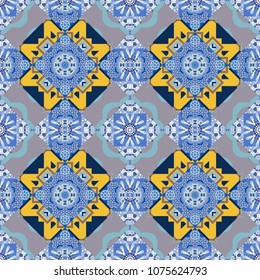 Vector colorful kaleidoscopic seamless pattern for textile, ceramic tiles, wallpapers and fabric. Traditional ethnic background in yellow, blue and violet colors.