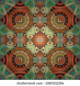Vector colorful kaleidoscopic seamless pattern for textile, ceramic tiles, wallpapers and fabric. Traditional ethnic background in brown, yellow and orange colors.
