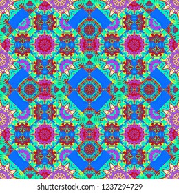 Vector colorful kaleidoscopic seamless pattern for textile, ceramic tiles, wallpapers and fabric. Traditional ethnic background in blue, green and red colors.