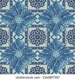 Vector colorful kaleidoscopic seamless pattern for textile, ceramic tiles, wallpapers and fabric. Traditional ethnic background in brown, blue and gray colors.