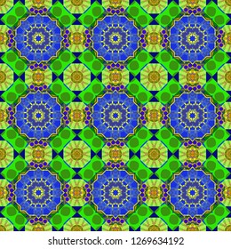 Vector colorful kaleidoscopic seamless pattern for textile, ceramic tiles, wallpapers and fabric. Traditional ethnic background in green, blue and yellow colors.