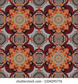 Vector colorful kaleidoscopic seamless pattern for textile, ceramic tiles, wallpapers and fabric. Traditional ethnic background in brown, gray and orange colors.