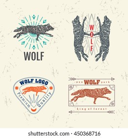 Vector colorful set with forest wolf. The wolf as main element of logotypes on beige background. Engraves vector design graphic element, emblem, logo, sign, identity, logotype