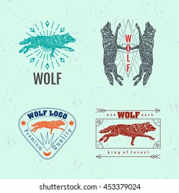 Vector colorful set with forest wolf. The wolf as main element of logotypes on light blue background. 