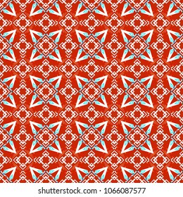 Vector colorful symmetrical seamless pattern for textile, tiles and design in red, orange and white tones.