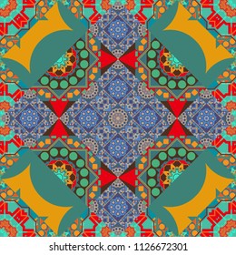 Vector colorful symmetrical seamless pattern for textile, tiles and design in blue, green and yellow tones.