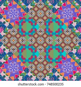 Vector colorful symmetrical seamless pattern for textile, tiles and design in blue, green and violet tones.