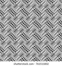 Vector colorful symmetrical seamless pattern for textile, tiles and design in gray, black and white tones.