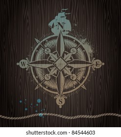 Vector compass painting on a wooden wall