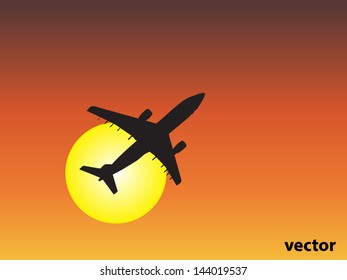 Vector concept or conceptual black plane,airplane aircraft silhouette flying over sky at sunset,sunrise background,metaphor to air,travel,transportation,jet,flight,transport,business,vacation,tourism